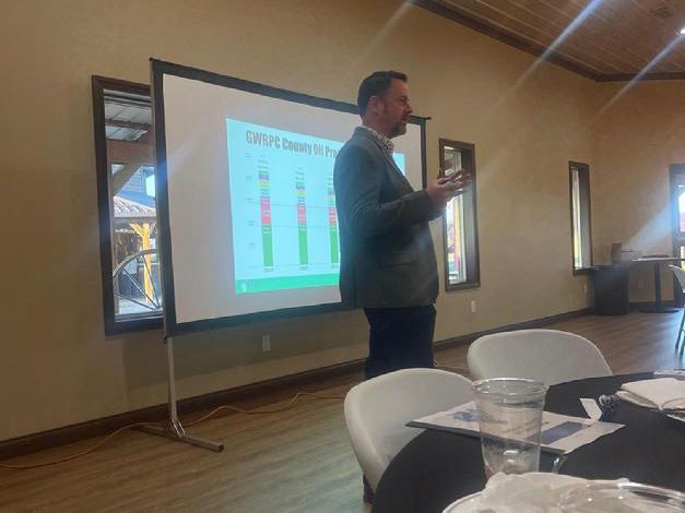 Businessman in Suit Leading a Presentation to an Audience.